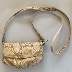 Anthropologie Faux Snake print clutch with detachable strap .